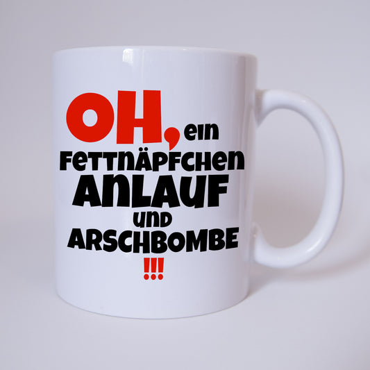 Oh, ein Fettnäpfchen... Anlauf und Arschbombe !!! - Tasse